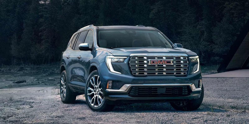 Front view of the 2026 GMC Acadia showcasing its bold grille and LED headlights