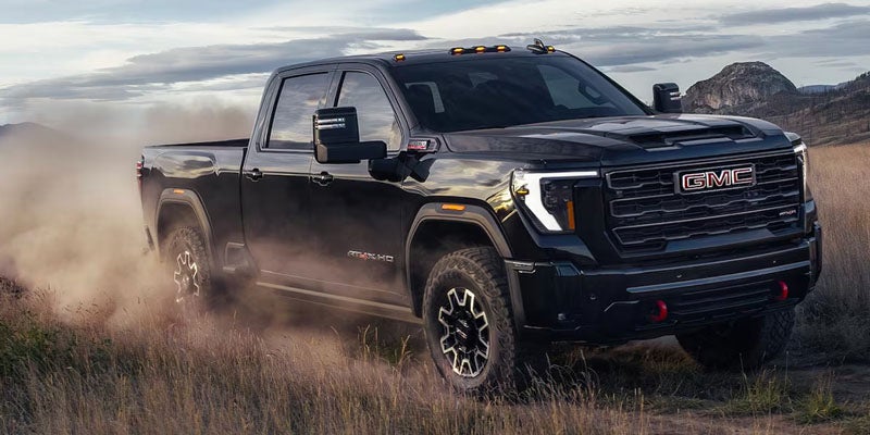2026 GMC Sierra 3500 HD Chassis Cab SLE tackling rugged terrain near Paris, TN