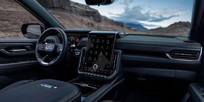 Premium interior of the 2026 GMC Yukon with leather seating and panoramic display